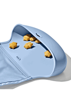 
                        
                          Load image into Gallery viewer, OXO Tot Roll-Up Bib Dusk - Online Exclusive
                        
                      