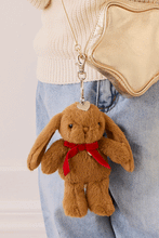 
                        
                          Load image into Gallery viewer, Snuggle Bunnies Penelope Keyring - Toffee hook with a golden bag
                        
                      