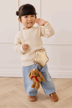 
                        
                          Load image into Gallery viewer, Snuggle Bunnies Penelope Keyring  in color Toffee with a toddler a cute position
                        
                      