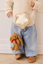 
                        
                          Load image into Gallery viewer, Snuggle Bunnies Penelope Keyring  in color Toffee  close up with golden star bag
                        
                      