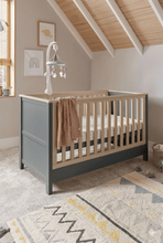 
                        
                          Load image into Gallery viewer, Mamas &amp; Papas Harwell Cotbed color in Grey Natural with mobile 45 angle view
                        
                      