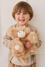 
                        
                          Load image into Gallery viewer, Child holding a fluffy brown toy against a white background
                        
                      