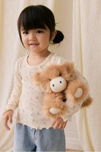 
                        
                          Load image into Gallery viewer, Child holding a plush toy in front of a neutral background
                        
                      