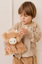 
                        
                          Load image into Gallery viewer, Child holding a fluffy brown toy with a white face against a plain background
                        
                      