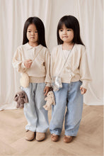 
                        
                          Load image into Gallery viewer, Snuggle_Bunnies_Penelope_Keyring_color_in_Spice 2 girls standing together
                        
                      