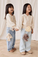 
                        
                          Load image into Gallery viewer, Snuggle Bunnies Penelope Keyring color in Spice two girl hold hand laughing
                        
                      
