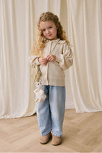 
                        
                          Load image into Gallery viewer, Snuggle Bunnies Rosie Keyring - Rosie The Duck a toddler standing at the centre point with a blue jeans and a small golden bag hook with rosie keyring
                        
                      