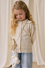 
                        
                          Load image into Gallery viewer, Snuggle Bunnies Rosie Keyring - Rosie The Duck, a toddler girl wearing jean with a golden star bag with a roise keyrign
                        
                      