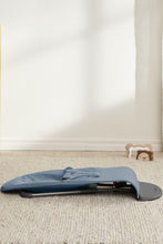 
                        
                          Load image into Gallery viewer, Blue baby bouncer on a beige carpet with a white wall in the background
                        
                      