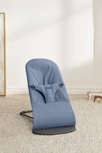 
                        
                          Load image into Gallery viewer, Blue baby bouncer on a beige carpet with a white wall background
                        
                      