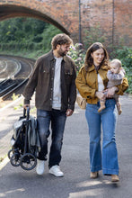 
                        
                          Load image into Gallery viewer, joie parcel lx eclipse  a  man holding folded stroller
                        
                      
