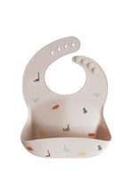 
                        
                          Load image into Gallery viewer, Mushie Silicone Baby Bib Dinosaurs 1
                        
                      