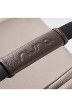 
                        
                          Load image into Gallery viewer, Nuna Infant Car Seat Close-up of a brown leather handle in colour chateau
                        
                      